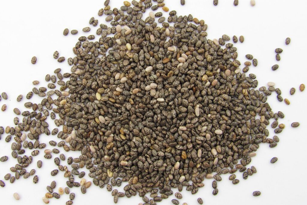a pile of seeds on a white surface